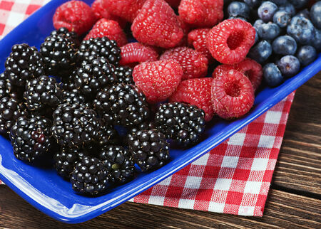 fresh blackberries, raspberries and blueberries on the tableの写真素材