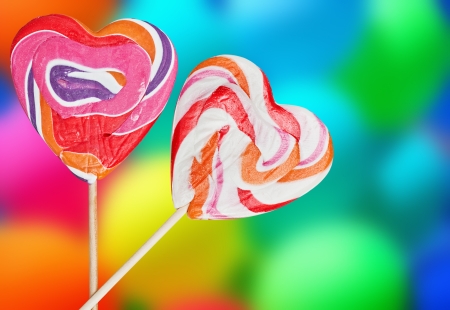 Colorful spiral lollipops on a colored backgroundの写真素材