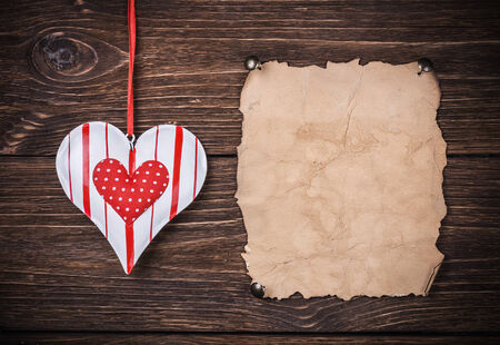 Old paper with heart and place for congratulations Valentineの写真素材