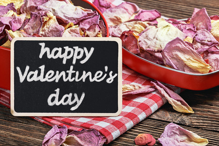 blackboard for the text and dried flowers roses. Surprise Valentine's Dayの写真素材