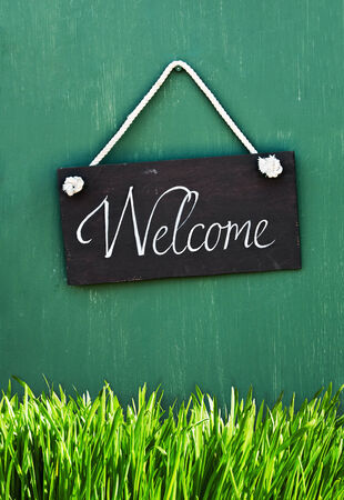 blackboard with the words welcome to hang on the doorの写真素材