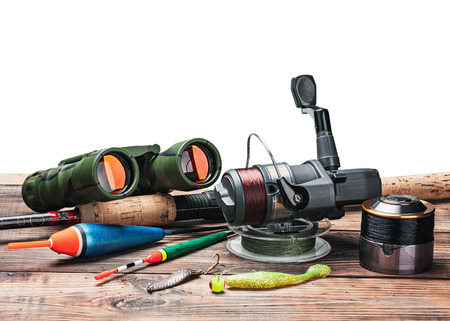 fishing tackle on the table isolated on white backgroundの写真素材