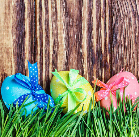 decorated easter egg in the grassの写真素材