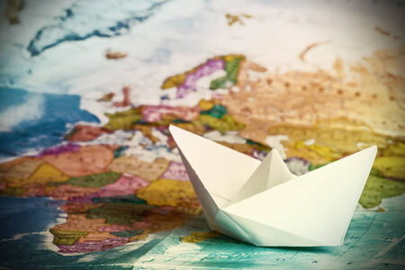 ship from a paper on the geographical map の写真素材