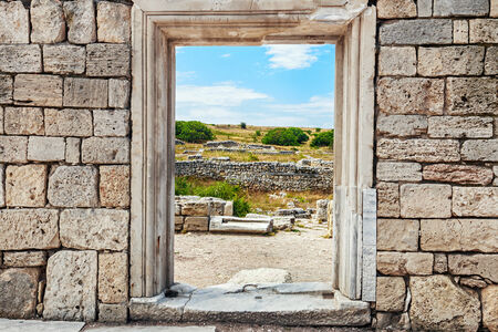 wall of stones with a hole under the door. Cultural monument Chersonese, Sevastopol, Crimea.の写真素材