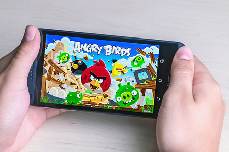 Moscow, Russia - August 26, 2014: Angry Birds computer game developed by Finnish company Rovio Entertainment first released in 2009. It sold over 2 billion copies across all platformsのeditorial素材