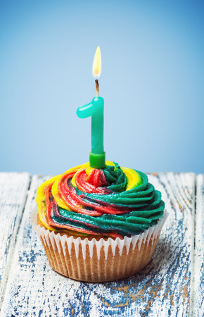 Cupcake with number one on a blue backgroundの写真素材