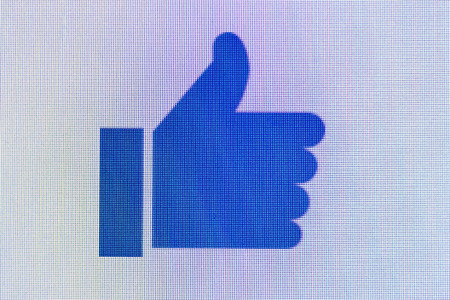 Moscow, Russia - September 24, 2014:Like us on Facebook icon on computer screen. Facebook is one of the largest social networks in the world. Was founded in 2004 by Mark Zuckerbergのeditorial素材