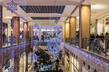RUSSIA, MOSCOW - December 21, 2013: People enter to Metropolis shop before Christmas, Russia. Metropolis - the largest shopping and entertainment center of Moscow.のeditorial素材