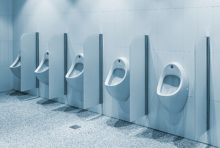 urinals in a public toilet, background. toningの写真素材