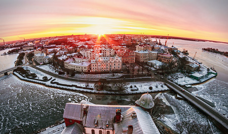 View of the historic city of Vyborg from St. Olav tower, at dawn. Russia. Focus on the central...