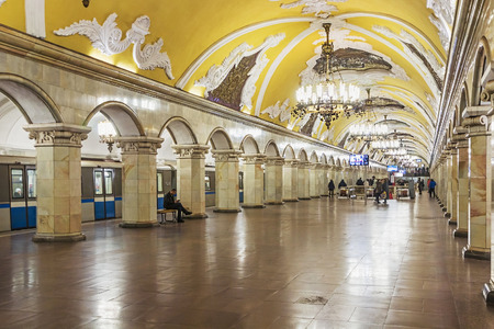MOSCOW, RUSSIA - April 3, 2015: Tourists at the metro station Komsomolskaya in Moscow, Russia. Metro station Komsomolskaya is a monument of the Soviet era.ocus on the central chandelierのeditorial素材