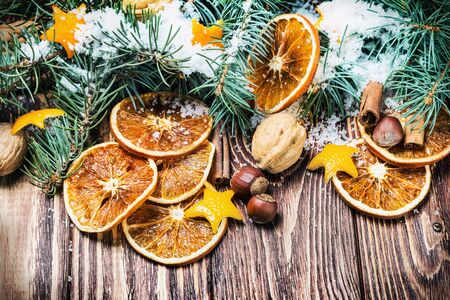 dried oranges with nuts and fir branches. Christmas decorationsの写真素材