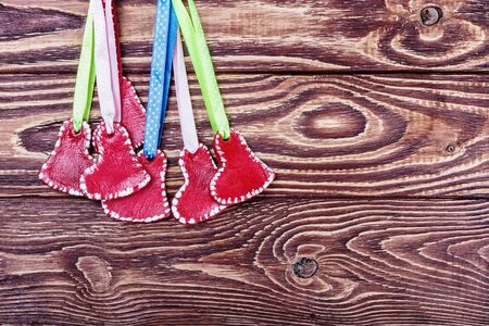 red hearts on a wooden background. It can be used for congratulations valentine or mother's dayの写真素材