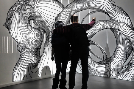 Moscow, Russia - January 28, 2015: Visitors to the exhibition center "Mars". Center "MARC" platform for showcasing art projects affecting all human senses. Focus on exhibitのeditorial素材