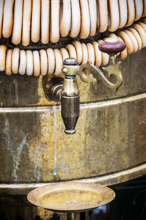 samovar and fresh bagels for tea at the fair. focus on the tap of the samovar