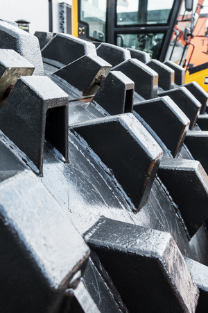 Construction compactor in the operation. Construction compactor photographed close up. focus in the...