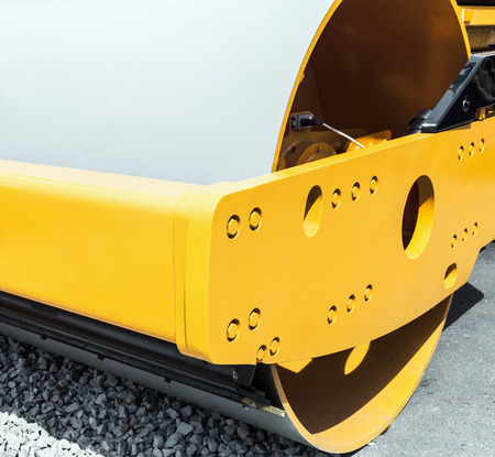 Construction compactor in the operation. Construction compactor photographed close up. focus in the...