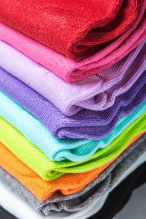 Textile colorful socks background. colorful background. Green, pink, red, blue yellow and other colorsの写真素材