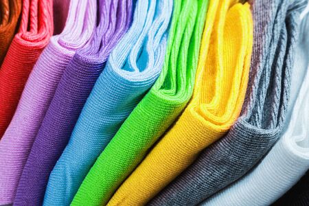 Textile colorful socks background. Green, pink, red, blue yellow and other colorsの写真素材