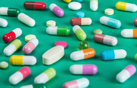 pills and tablets of different green backgroundの写真素材