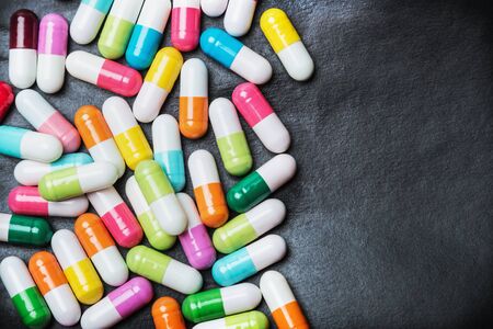 Different colors assorted pills and capsules pharmaceutical medicineの写真素材
