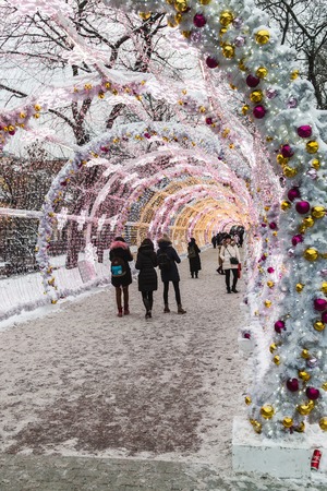 MOSCOW, RUSSIA - January 14, 2017: People and tourists walk along Moscow decorated for New Year and Christmas holidays. Christmas village fair on Tverskaya street in the Moscowのeditorial素材