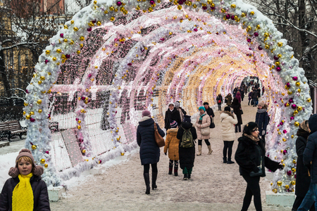 MOSCOW, RUSSIA - January 14, 2017: People and tourists walk along Moscow decorated for New Year and Christmas holidays. Christmas village fair on Tverskaya street in the Moscowのeditorial素材