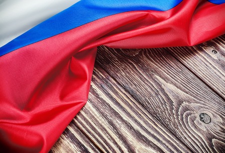 Russian flag background on a wooden table