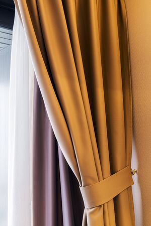 curtains and blinds hanging in the room backgroundの写真素材