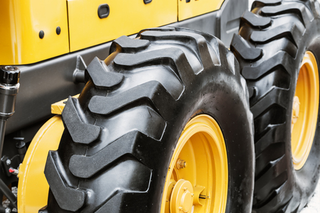wheel of the tractor or other construction equipment large. focus on rubber wheelsの写真素材