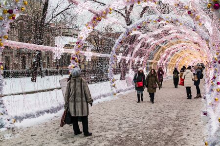 MOSCOW, RUSSIA - January 13, 2017: People and tourists walk along Moscow decorated for New Year and Christmas holidays. Christmas village fair on Tverskaya street in the Moscowのeditorial素材