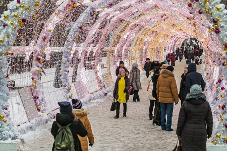 MOSCOW, RUSSIA - January 13, 2017: People and tourists walk along Moscow decorated for New Year and Christmas holidays. Christmas village fair on Tverskaya street in the Moscowのeditorial素材