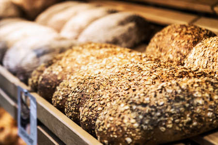 freshly baked bread and bakery products on the counterの写真素材