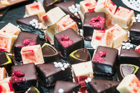 chocolate candy with filling, nuts and fruits. Real bitter chocolateの写真素材