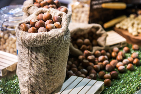 hazelnuts of different types. focus on the nuts in the bag