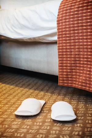 white Slippers in the hotel room or in the room of the houseの写真素材