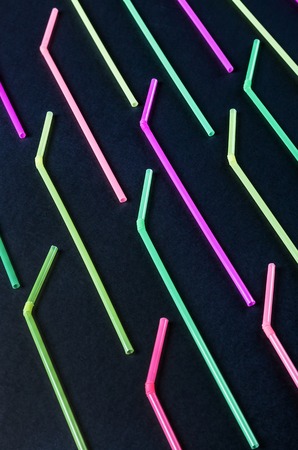 different color cocktail tubes on black backgroundの写真素材