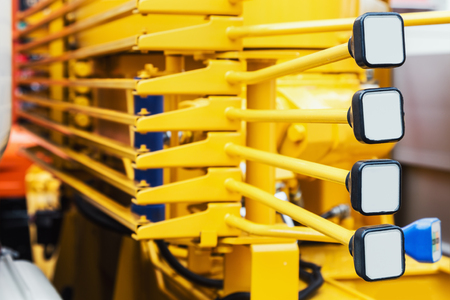 Levers of management of construction equipment on the tractor, the excavator, the grader, etc.