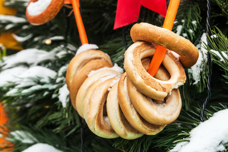 bagels in the snow on the Christmas tree at the fairの写真素材