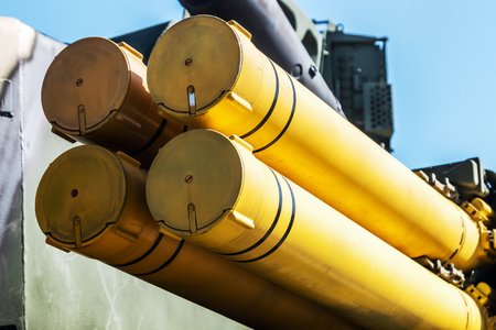 trunks of the weapon of installation of jet system of volley fire against the blue skyの写真素材