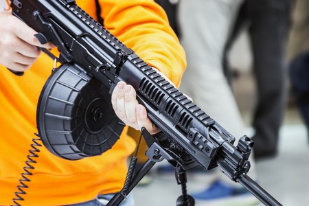 hands holding modern weapons. modern technologies in the production of weapons and weapons