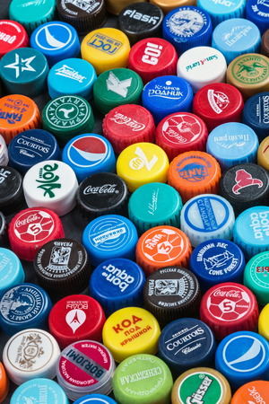 Moscow, Russia-September 7, 2018: plastic caps from different drinks, from beer, soda, cola, mineral water. Popular brands: Coca Cola Fanta mineral water Pepsi etcのeditorial素材