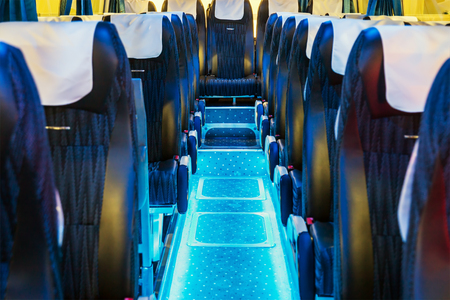 modern and comfortable long-distance and international vehicle bus salon with empty passenger seatsの写真素材