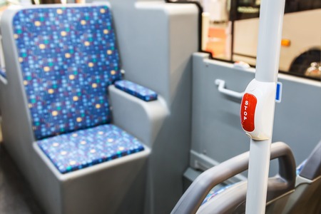 stop button modern and comfortable interior of the city bus. There is a dedicated Brailleの写真素材
