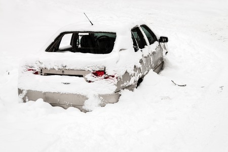 car is destroyed in the snow. The car was hit by an avalancheの写真素材