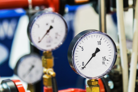 pressure gauge for measuring installed in water or gas systems. Plumbing, fixing pipes and fittings...