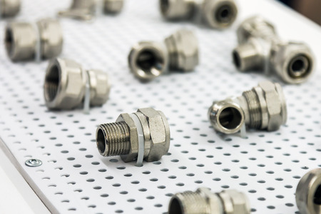 metal pipes, couplings and fittings. Plumbing, fixing pipes and fittings for connection of water or...