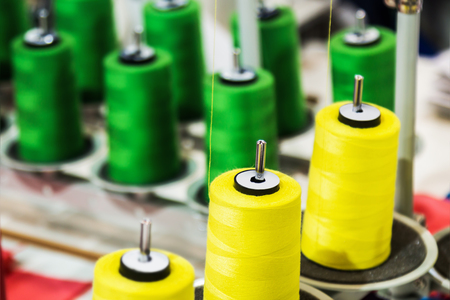 different color spools of thread for the textile industry the sewing machine