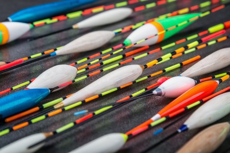many fishing floats made of balsa, peacock feathers and wood. fishing tackle and accessories for...